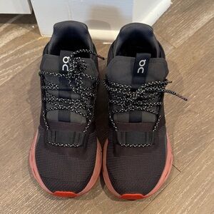 On Running women’s Black and Coral Sneakers